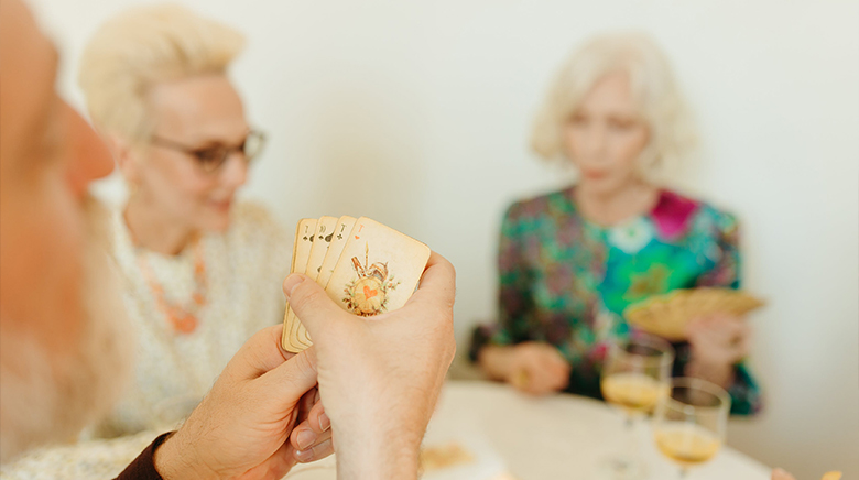 group of female residents playing cards together