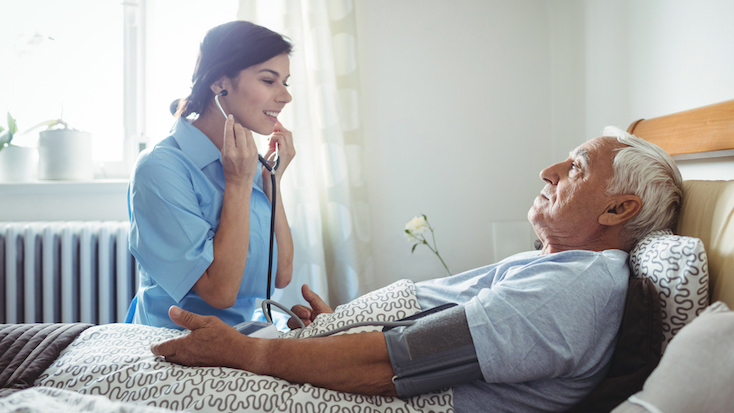 resident having their heart beat listened to