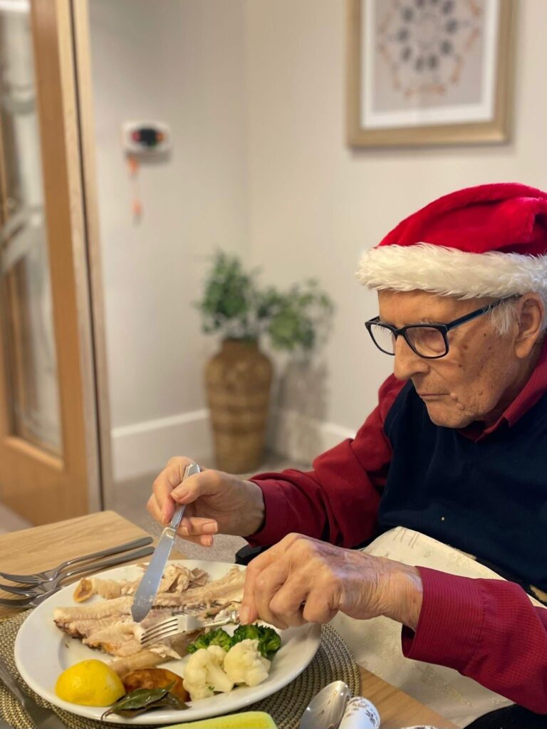 resident enjoying christmas dinner