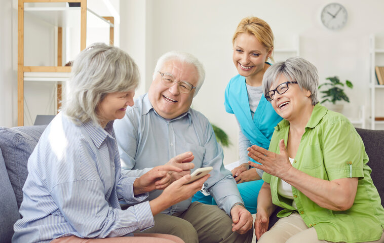 group of senior people in a care home enjoying respite care