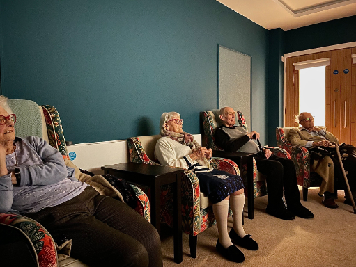 residents watching a film in our cinema room