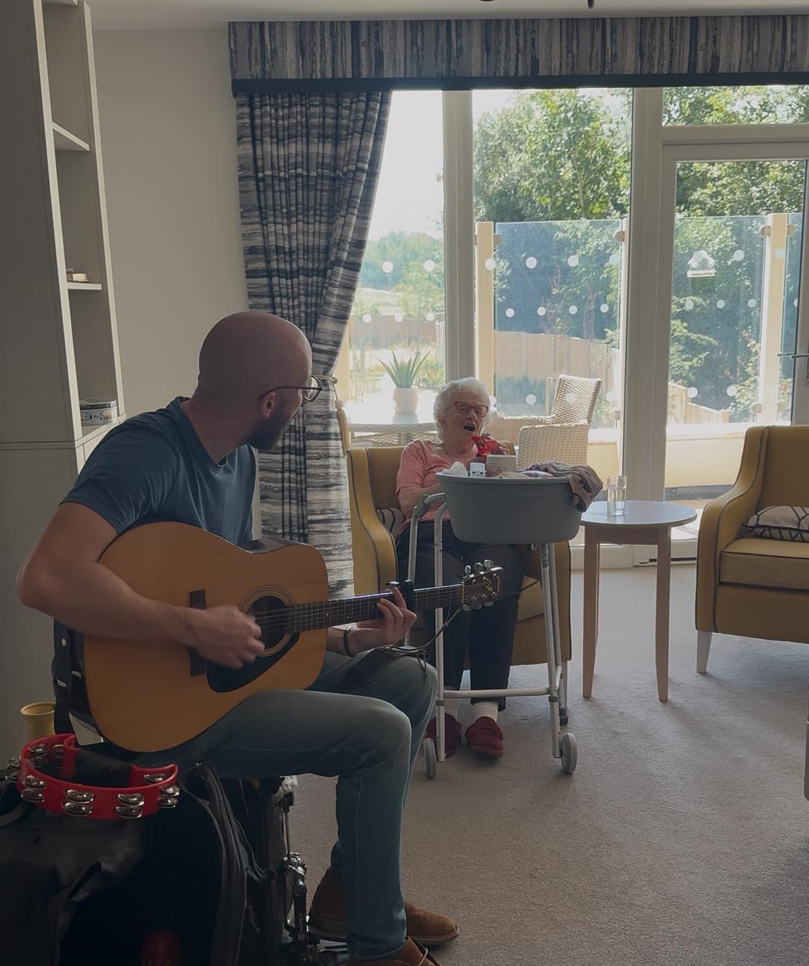 man-playing-a-guitar-for-residents