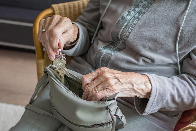 elderly woman getting keys outof her bag