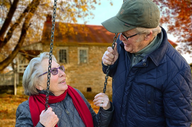 elderly couple on a swing