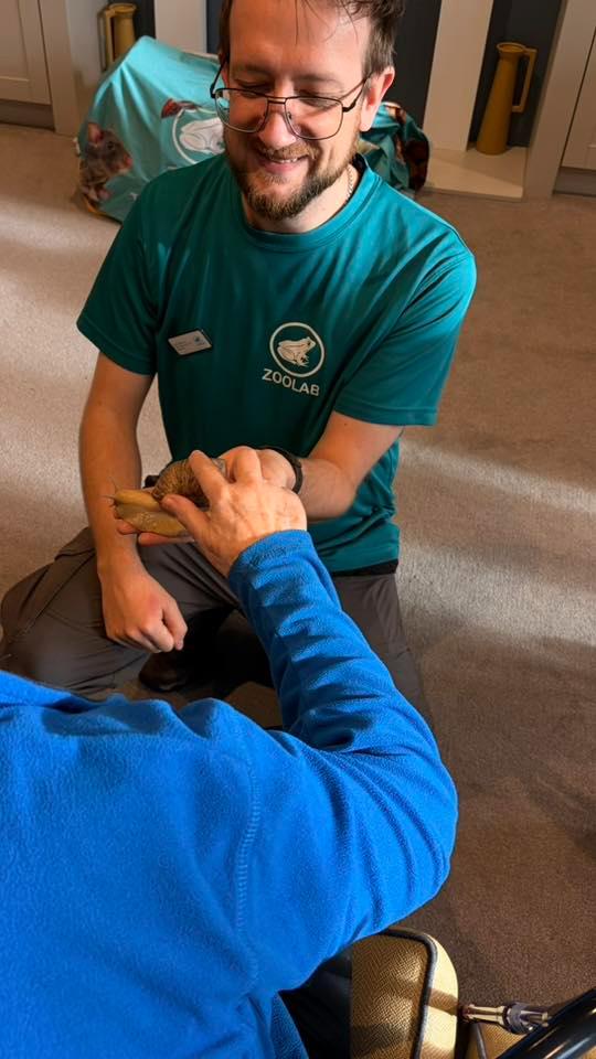 zoo lab man with snail and resident