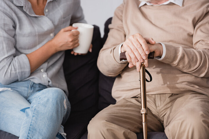 family talking about care homes over a cup of a tea