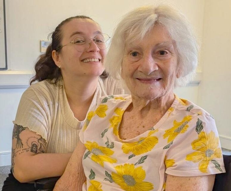 resident and carer smiling