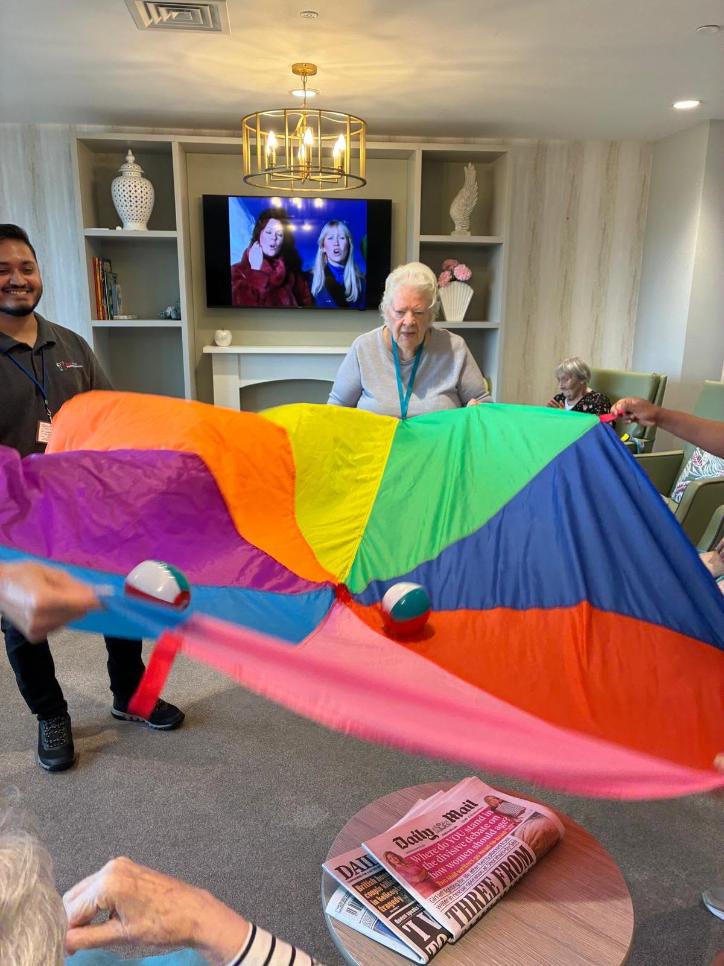 resident with tent game in lounge